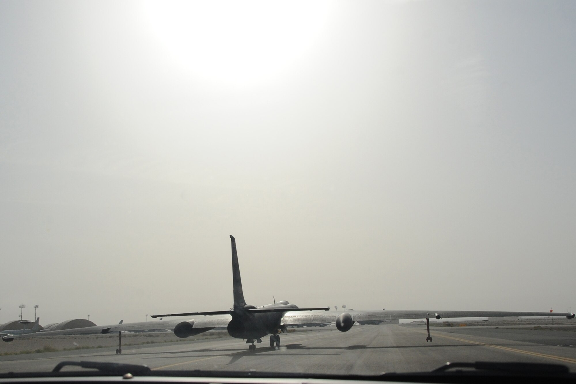 Po-gos, which connect underneath the wings of a U-2 Dragon Lady, prevent damage to the aircraft after it lands at an undisclosed location in Southwest Asia on April 30, 2010. The 380th Air Expeditionary Wing, supports Operations Iraqi Freedom and Enduring Freedom and the Combined Joint Task Force-Horn of Africa. The 380th AEW is comprised of four groups and 12 squadrons and the wing's deployed mission includes air refueling, surveillance and reconnaissance in support of overseas contingency operations in Southwest Asia. (U.S. Air Force photo/Senior Airman Jenifer H. Calhoun/Released)
