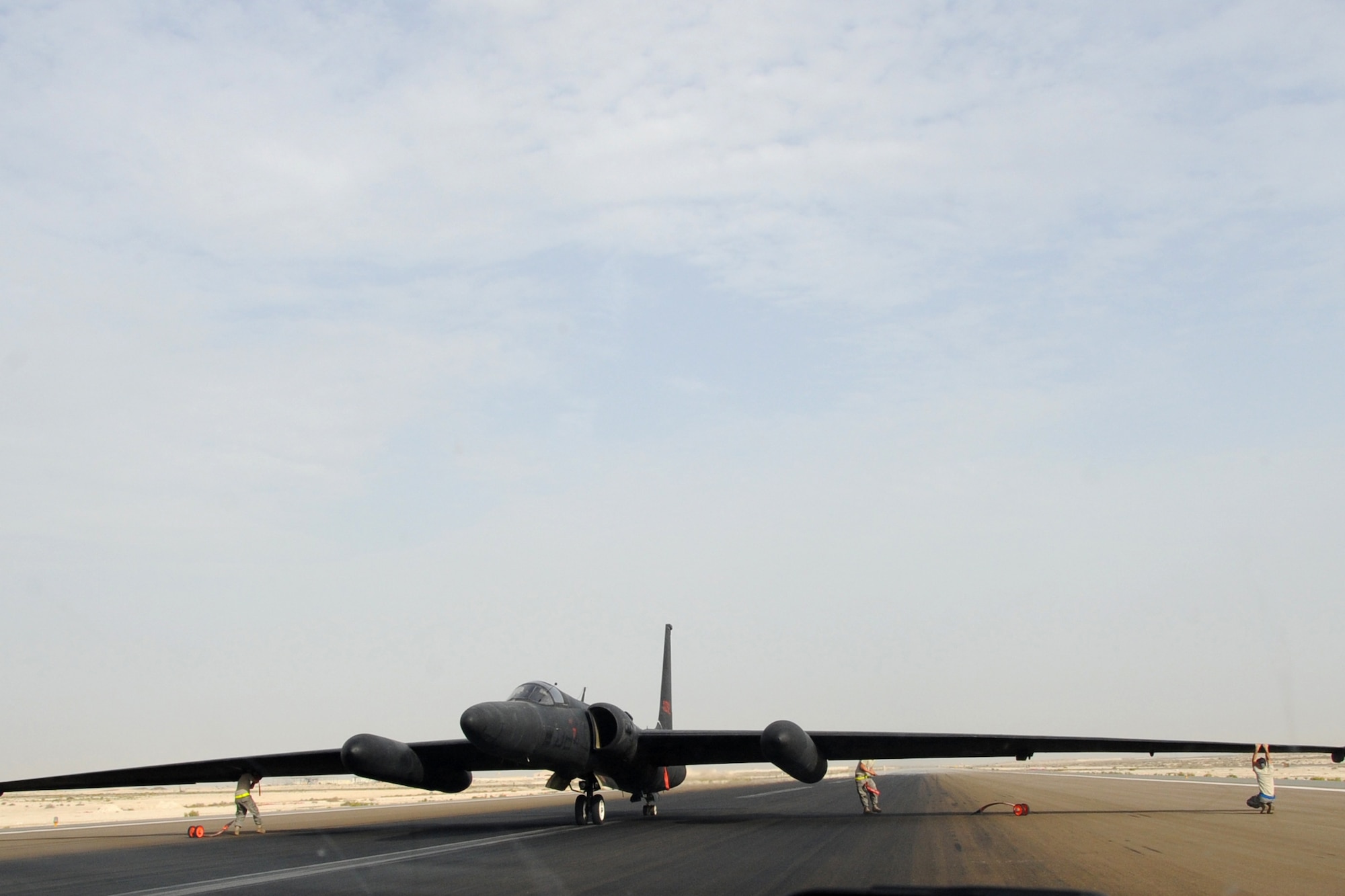 Maintainers from across the 380th Air Maintenance Squadron po-go team detach po-gos, which prevent U-2 Dragon Lady wings from becoming damaged, at an undisclosed location in Southwest Asia on April 30, 2010. The 380th Air Expeditionary Wing, supports Operations Iraqi Freedom and Enduring Freedom and the Combined Joint Task Force-Horn of Africa. The 380th AEW is comprised of four groups and 12 squadrons and the wing's deployed mission includes air refueling, surveillance and reconnaissance in support of overseas contingency operations in Southwest Asia. (U.S. Air Force photo/Senior Airman Jenifer H. Calhoun/Released)
