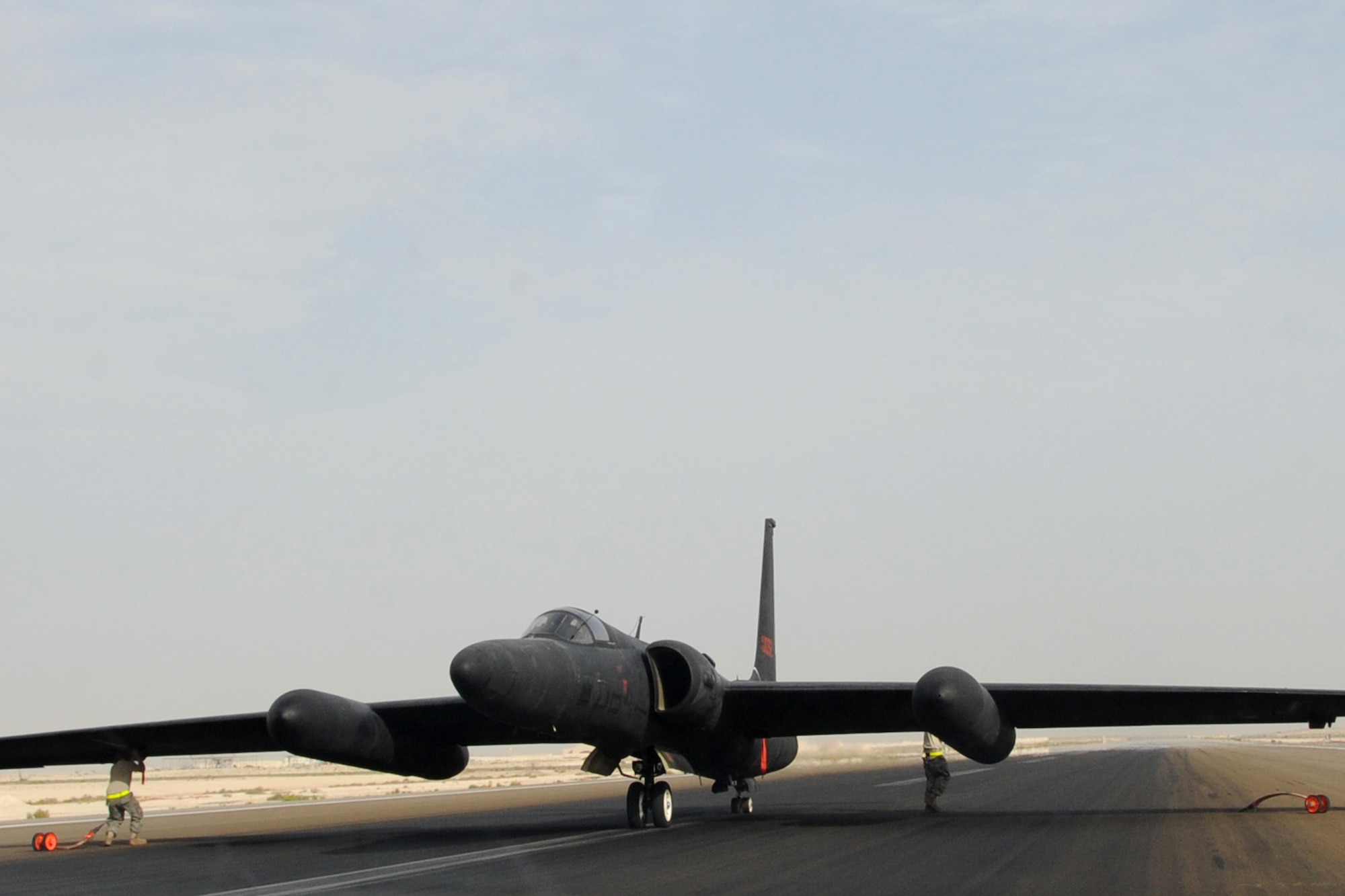 Maintainers from across the 380th Air Maintenance Squadron po-go team detach po-gos, which prevent U-2 Dragon Lady wings from becoming damaged, at an undisclosed location in Southwest Asia on April 30, 2010. The 380th Air Expeditionary Wing, supports Operations Iraqi Freedom and Enduring Freedom and the Combined Joint Task Force-Horn of Africa. The 380th AEW is comprised of four groups and 12 squadrons and the wing's deployed mission includes air refueling, surveillance and reconnaissance in support of overseas contingency operations in Southwest Asia. (U.S. Air Force photo/Senior Airman Jenifer H. Calhoun/Released)
