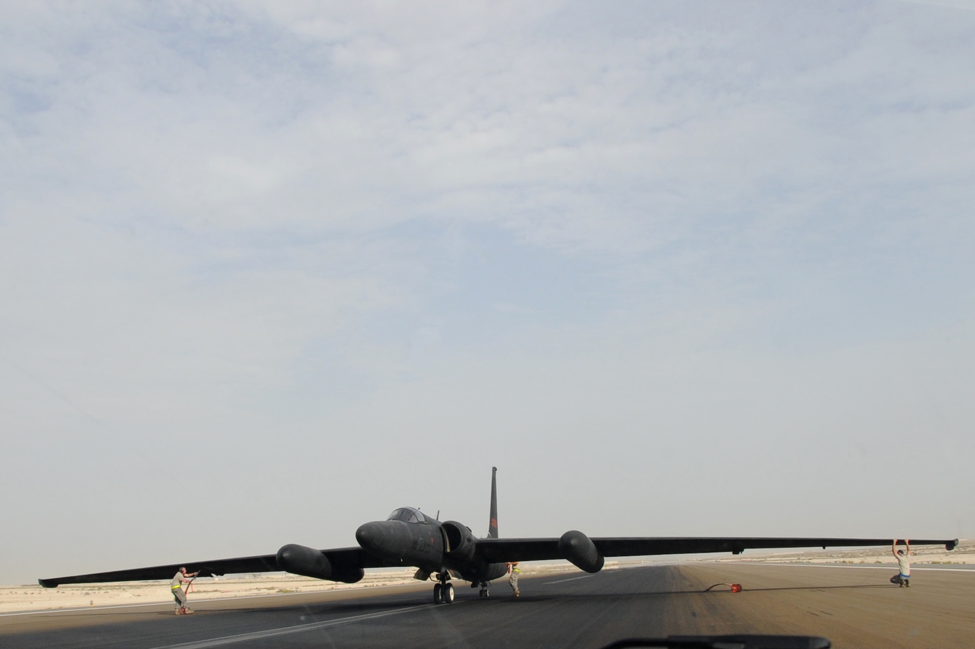 Maintainers from across the 380th Air Maintenance Squadron po-go team detach po-gos, which prevent U-2 Dragon Lady wings from becoming damaged, at an undisclosed location in Southwest Asia on April 30, 2010. The 380th Air Expeditionary Wing, supports Operations Iraqi Freedom and Enduring Freedom and the Combined Joint Task Force-Horn of Africa. The 380th AEW is comprised of four groups and 12 squadrons and the wing's deployed mission includes air refueling, surveillance and reconnaissance in support of overseas contingency operations in Southwest Asia. (U.S. Air Force photo/Senior Airman Jenifer H. Calhoun/Released)
