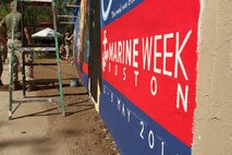U. S. Marine Corps Lance Cpl. Pablo Morrison, Combat Reproduction Specialist, Marine Corps Base Quantico, Va., paints a Marine Corps themed mural at Hyde Park, Boston in support of Marine Week Boston, May 5, 2010. Marine Week Boston provides an opportunity to increase public awareness of the Marine Corps' value to our nation's defense and to preserve and mature the Corps' relationship with the American people.