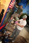 U. S. Marines paint a Marine Corps themed mural at Hyde Park, Boston in support of Marine Week Boston, May 5, 2010. Marine Week Boston provides an opportunity to increase public awareness of the Marine Corps' value to our nation's defense and to preserve and mature the Corps' relationship with the American people.