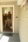 U. S. Marine Corps Staff Sergeants Matthew Stout (left) and Brad Widener of 3rd Battalion, 24th Marines, Johnson City, Tenn., help renovate the Robert J. Watson House, in Cambridge, Mass., in support of Marine Week Boston, May 5, 2010. Once Renovated, the Robert J. Watson House will be used as a shelter for troubled youth females. (Official U. S. Marine Corps photo by Lance Cpl. Natasha J. Combs)