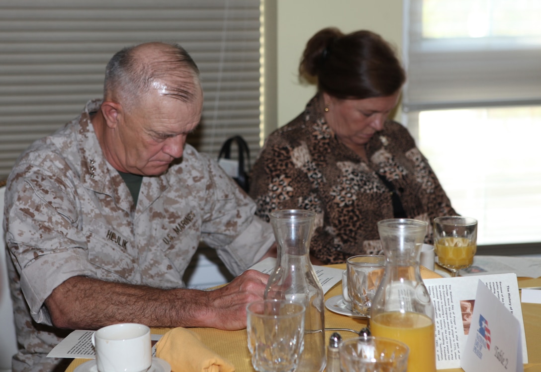 Lt. Gen. Dennis J. Hejlik (left), commanding general of II Marine Expeditionary Force, prays during the National Day of Prayer breakfast at the Paradise Point Officers’ Club aboard Marine Corps Base Camp Lejeune, May 6.  The National Day of Prayer was an open invitation and everyone from junior enlisted personnel to general officers attended the event to pay their respects and show support for the nation, its leaders and people.