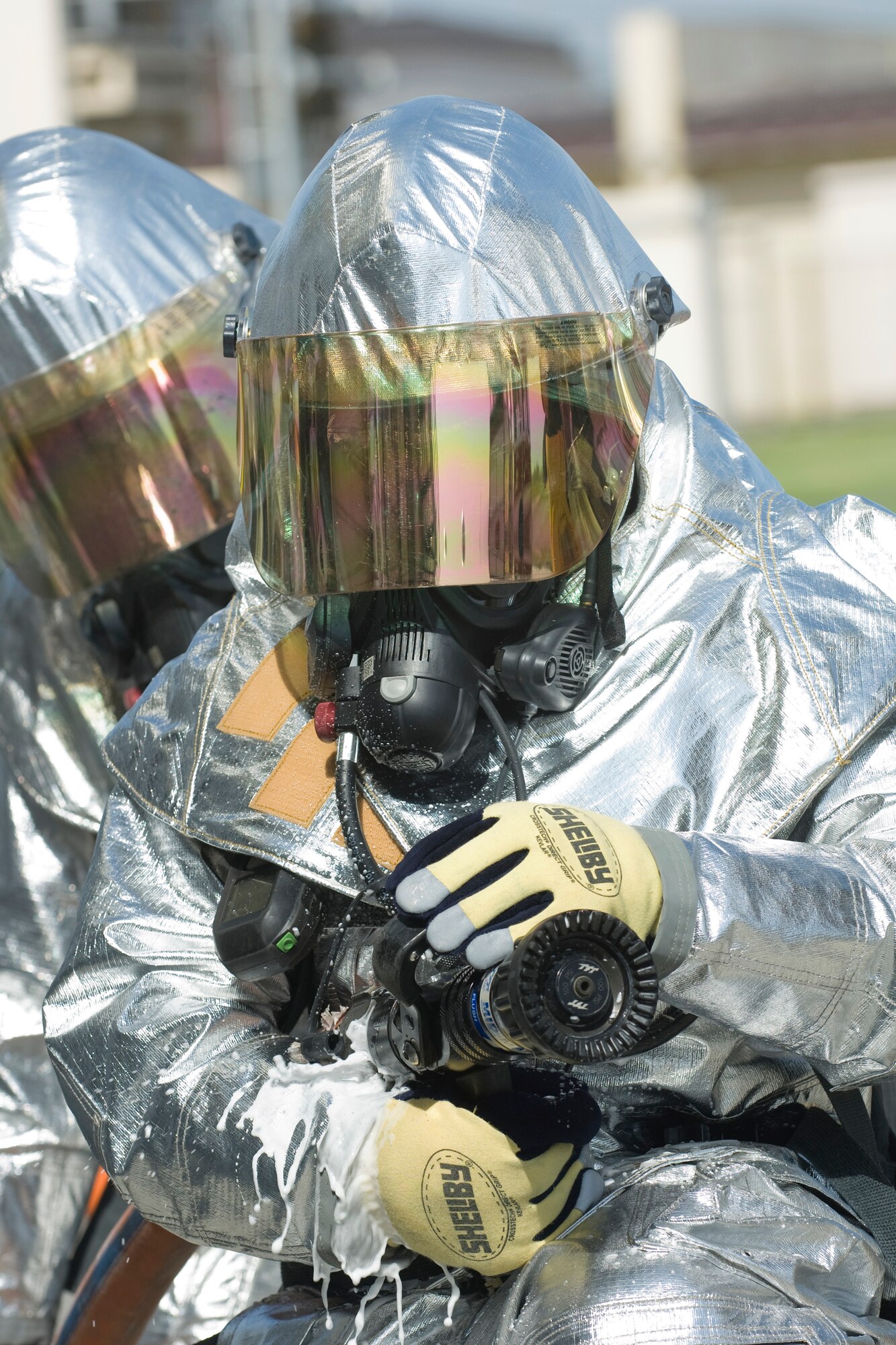 YOKOTA AIR BASE, Japan -- Col. Rafael Quezada, 374th Mission Support Group commander, readies for a simulated fire May 6. The 374th Civil Engineer Squadron and Fire Emergency Services Flight invited Col. Quezada to a simulated live fire structural exercise focusing on challenges firefighters encounter during real world situations. (U.S. Air Force photo/Osakabe Yasuo)