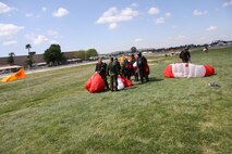 Tech. Sgt. Diane Ducat, Blue Eagles Total Force honor Guard and Air National Guard 163rd Reconnaissance Wing public affairs, back on the ground after her jump with the Canadian SkyHawks. (Canadian Forces SkyHawks Parachute Team photo)