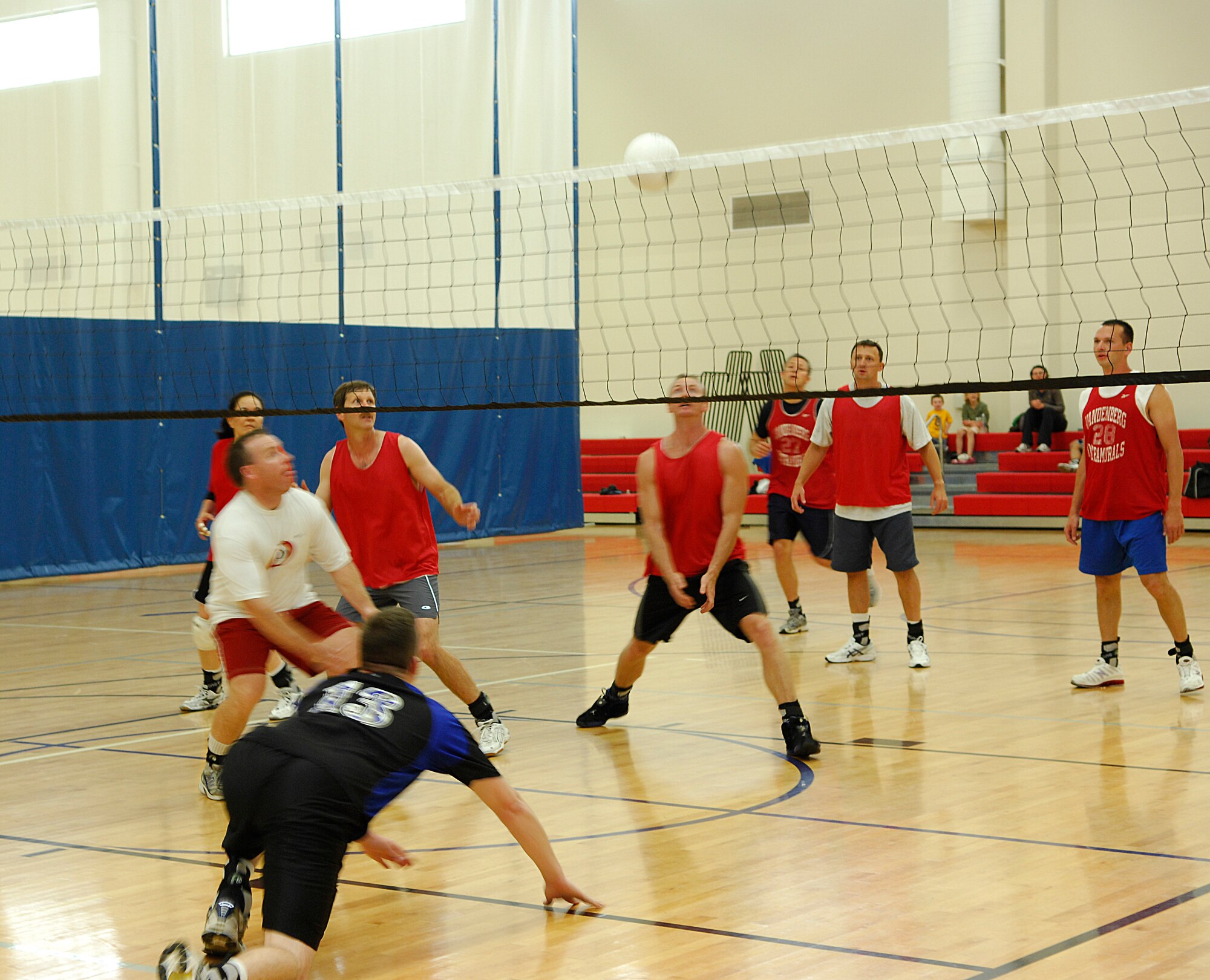 VANDENBERG AIR FORCE BASE, Calif. -- Giving it his all, Mark Sterrett, a 14th Air Force team member, dives to the ground trying to save a point during an intramural volleyball game here Wednesday, May 5, 2010. The 14th AF team was defeated by the 2nd Range Operations Squadron team 2-1. (U.S. Air Force photo/Senior Airman Heather R. Shaw)
