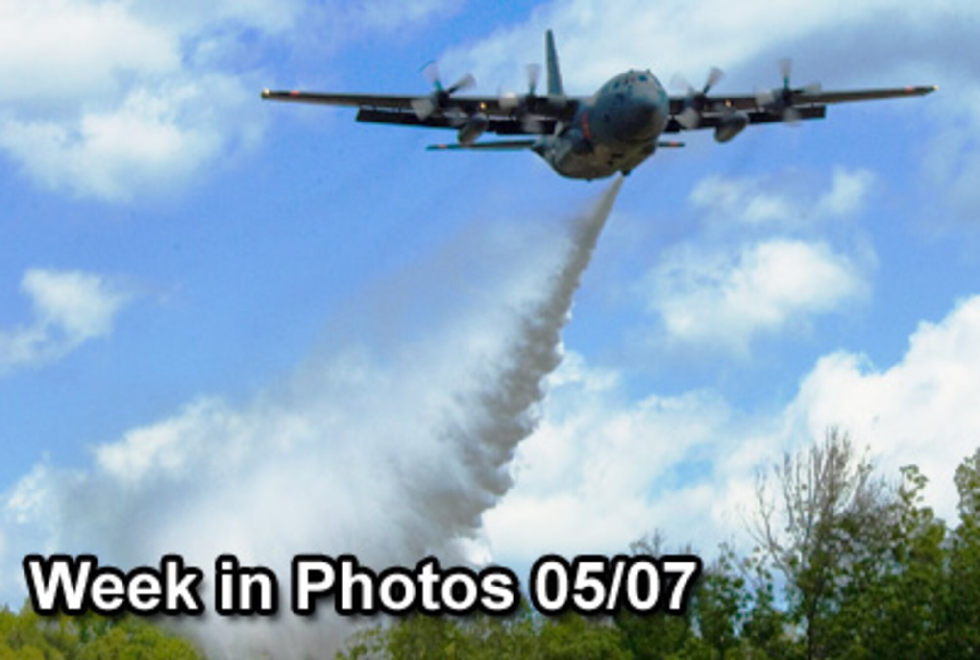 Air Force Week in Photos for May 7, 2010, highlights photos from around the Air Force. In this photo by Airman 1st Class Nicholas Carzis, a C-130 Hercules drops water over the treetops while training with the Modular Airborne Fire Fighting System near Greenville, S.C., April 28, 2010. (U.S. Air Force photo illustration)