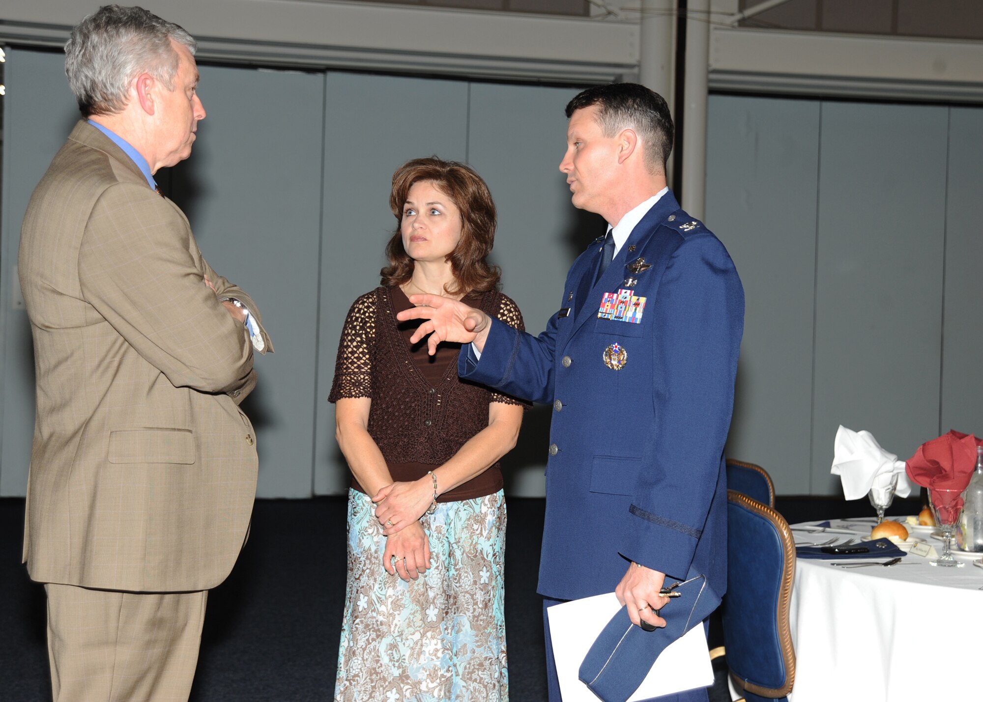 Col. James Crowhurst, 22nd Air Refueling Wing commander, and his wife Lisa talk to Wayne Roberts, Honorary Commander to Maj. Vincent Casquejo, 22nd Maintenance Squadron commander, during the 2010 Honorary Commander Change of Command ceremony May 5, 2010, McConnell Air Force Base, Kan. The ceremony acknowledge honorary commanders who have dedicated their time as part of Team McConnell, and formally introduced the incoming honorary commanders to the base leadership. Honorary commanders are civilian leaders from the community who are paired with each unit commander to learn the different aspects of Air Force way of life and McConnell’s mission. (U.S. Air Force photo/Senior Airman Maria Ruiz) 