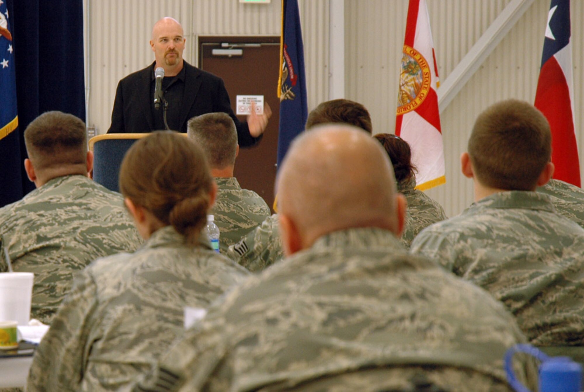 JOINT BASE LEWIS-MCCHORD, Wash. -- Seattle Seahawks Defensive Line Coach Dan Quinn speaks to Reservists at the 446th Airlift Wing Professional Development Seminar here May 4th. Mr. Quinn was one of the featured guest speakers at the semi-annual event designed to promote leadership and excellence among among 446th AW Reservists.  "You have to be authentic as a leader," said Quinn. "Let you be you, and lead by example."  (U.S. Air Force photo/Staff Sgt. Grant Saylor)