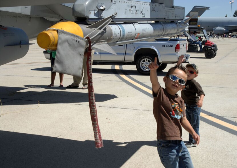A young AirFest spectator enjoys a static display at the March Field AirFest, March Air Reserve Base, Calif., May 1, 2010. March Field AirFest is a two-day event featuring performances and static displays of civilian and military aircraft. (U.S. Air Force photo by Senior Master Sgt. Kim Allain/Released)