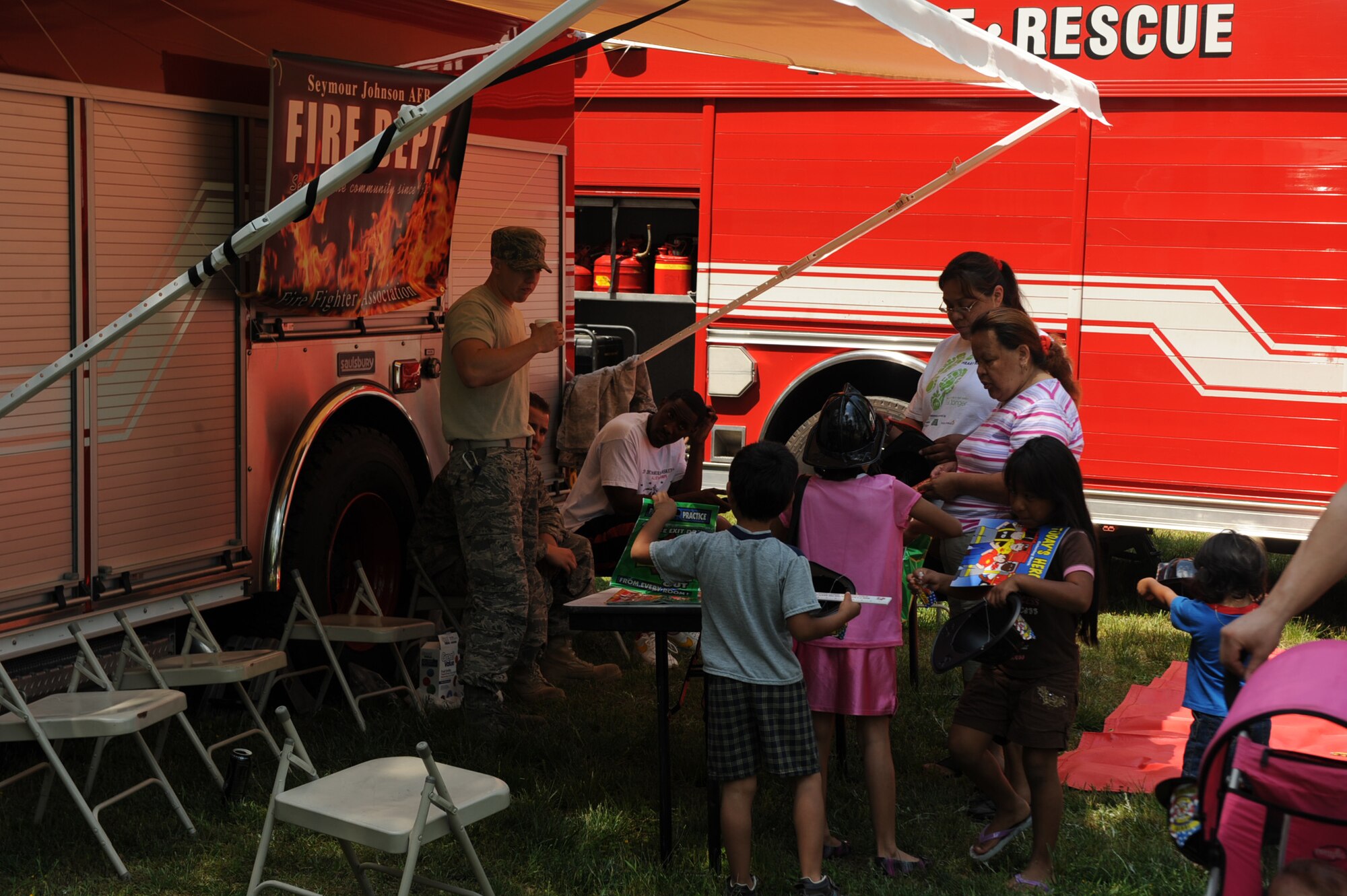 GOLDSBORO, N.C. -- Members from the 4th Civil Engineer Squadron at Seymour Johnson Air Force Base were on hand to provide information about fire safety, fighting fires and saving lives during Hike for Humanity at Stoney Creek Park May 1, 2010. More than 150 participants showed up for the walk to raise money for Habitat for Humanity. (U.S. Air Force photo/Senior Airman Ciara Wymbs) 
