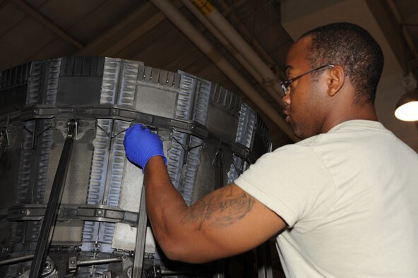 SEYMOUR JOHNSON AIR FORCE BASE, N.C. -- Airman 1st Class Eli Thompson inspects washers on an exhaust module, May 5, 2010. The module is the tail end of an F-100-220E jet engine used on F-15E Strike Eagles. Airman Thompson, 4th Component Maintenance Squadron jet engine mechanic, hails from Detroit. (U.S. Air Force photo/Airman 1st Class Gino Reyes)