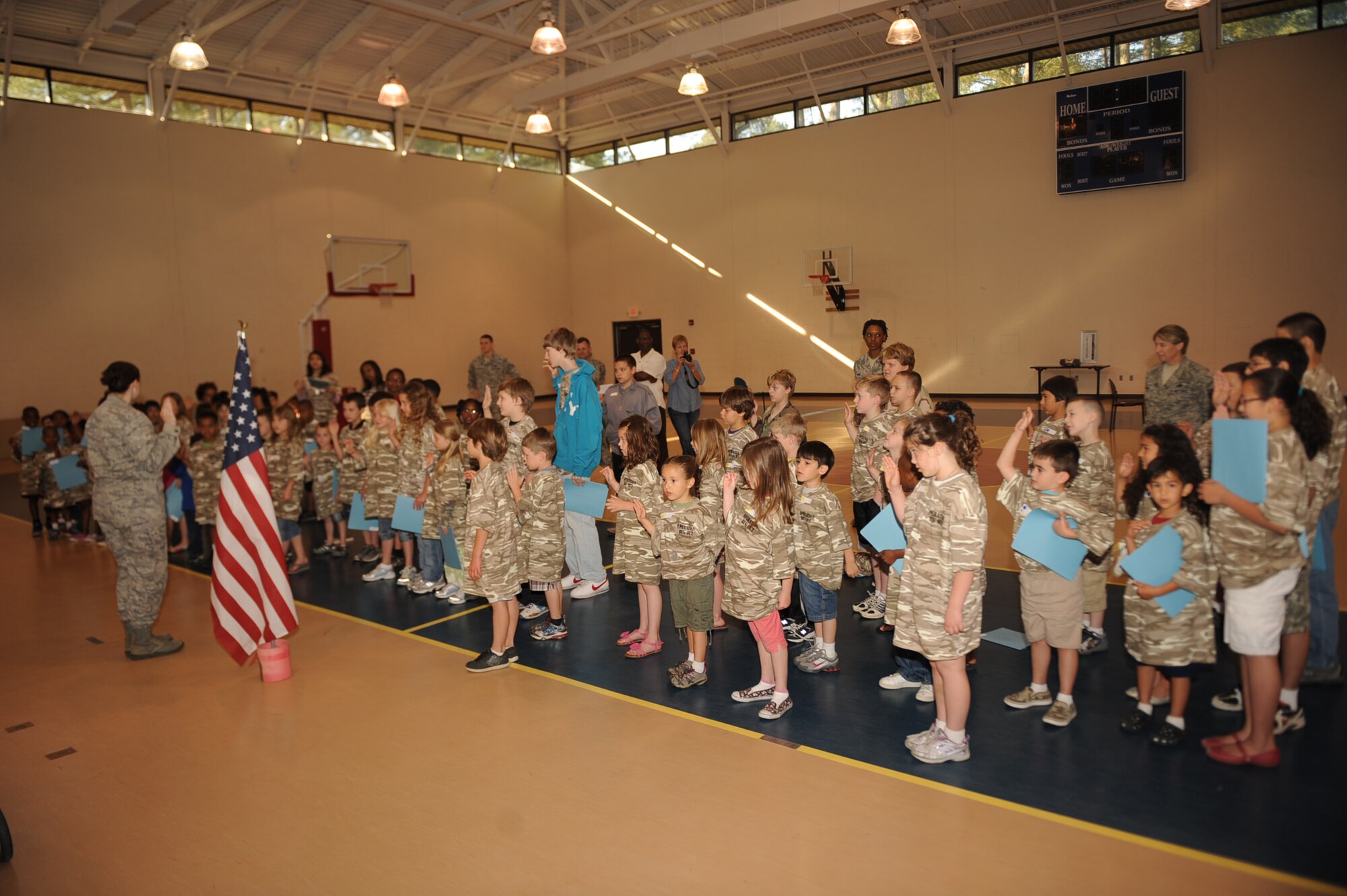 SEYMOUR JOHNSON AIR FORCE BASE, N.C. -- Capt. Julie Harrison gives the oath of enlistment to children participating in Operation Bug Out at the youth center April 30, 2010. The event was open to children ages 5-15. Captain Harrison is the 4th Force Support Squadron Airman and Family services flight chief and hails from Brookings, S.D. (U.S. Air Force photo/Senior Airman Ciara Wymbs)
