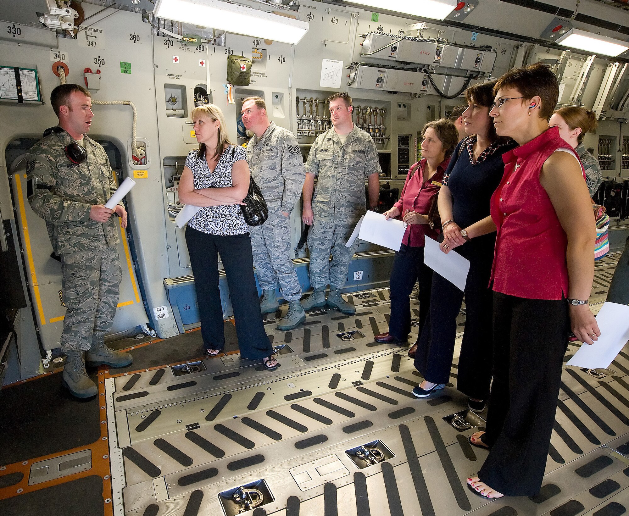 Spouses and volunteers who assist 512th and 436th Airlift Wing Airman and Family Readiness toured a C-17 Globemaster III here May 5. (U.S. Air Force photo/Jason Minto).  