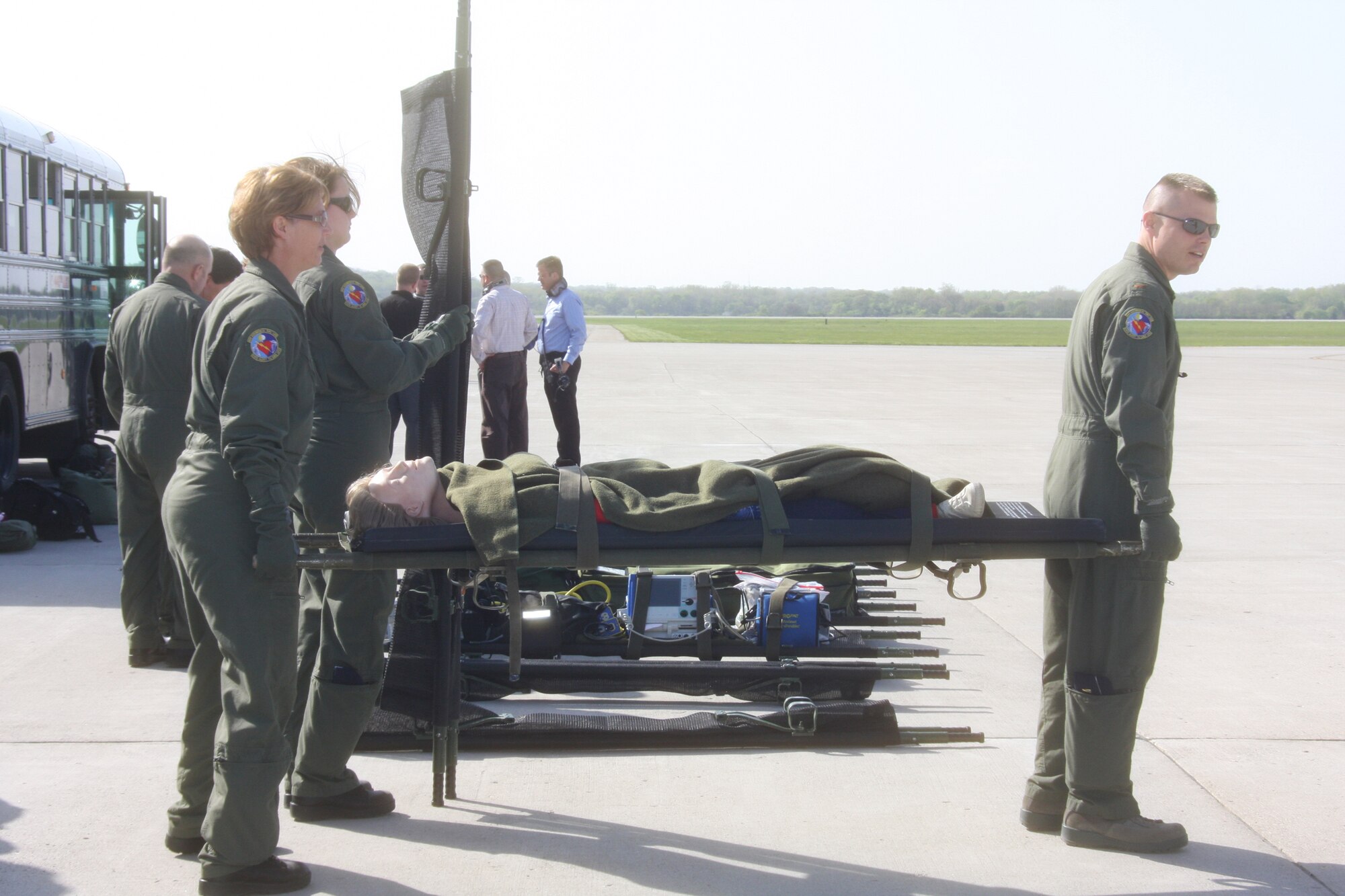 WRIGHT-PATTERSON AIR FORCE BASE, Ohio – 2nd Lt. William Sikes and Tech. Sgt. Tamella Hill, both from the 445th Aeromedical Evacuation Squadron, transport a patient litter to an awaiting aircraft during an AES training flight April 21.  Members of the 445th AES are ready to fill the need when events like natural disasters, war or routine medical transportation by air is required. (U.S. Air Force photo/Staff Sgt. Amanda Duncan)