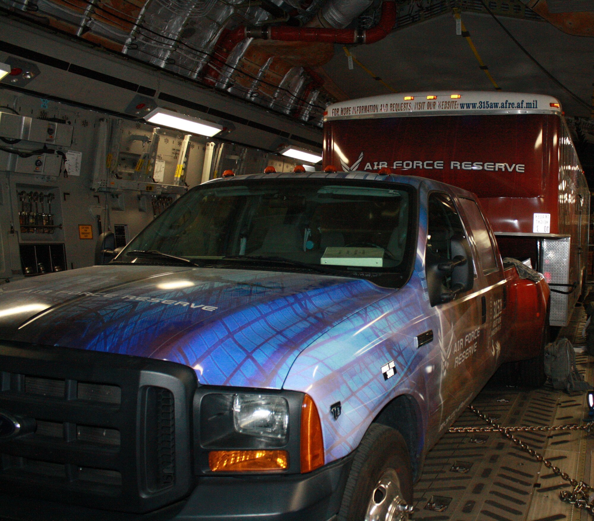The 315th Airlift Wing Mini C-17 is loaded into a trailer and transported aboard a C-17 from March Air Reserve Base Calif. enroute to AirFest 2010.The Mini C-17 is a recruiting and community outreach tool for the 315th AW and the Air Force Reserve (U.S. Air Force Photo/ TSgt Beth Holzbaur)