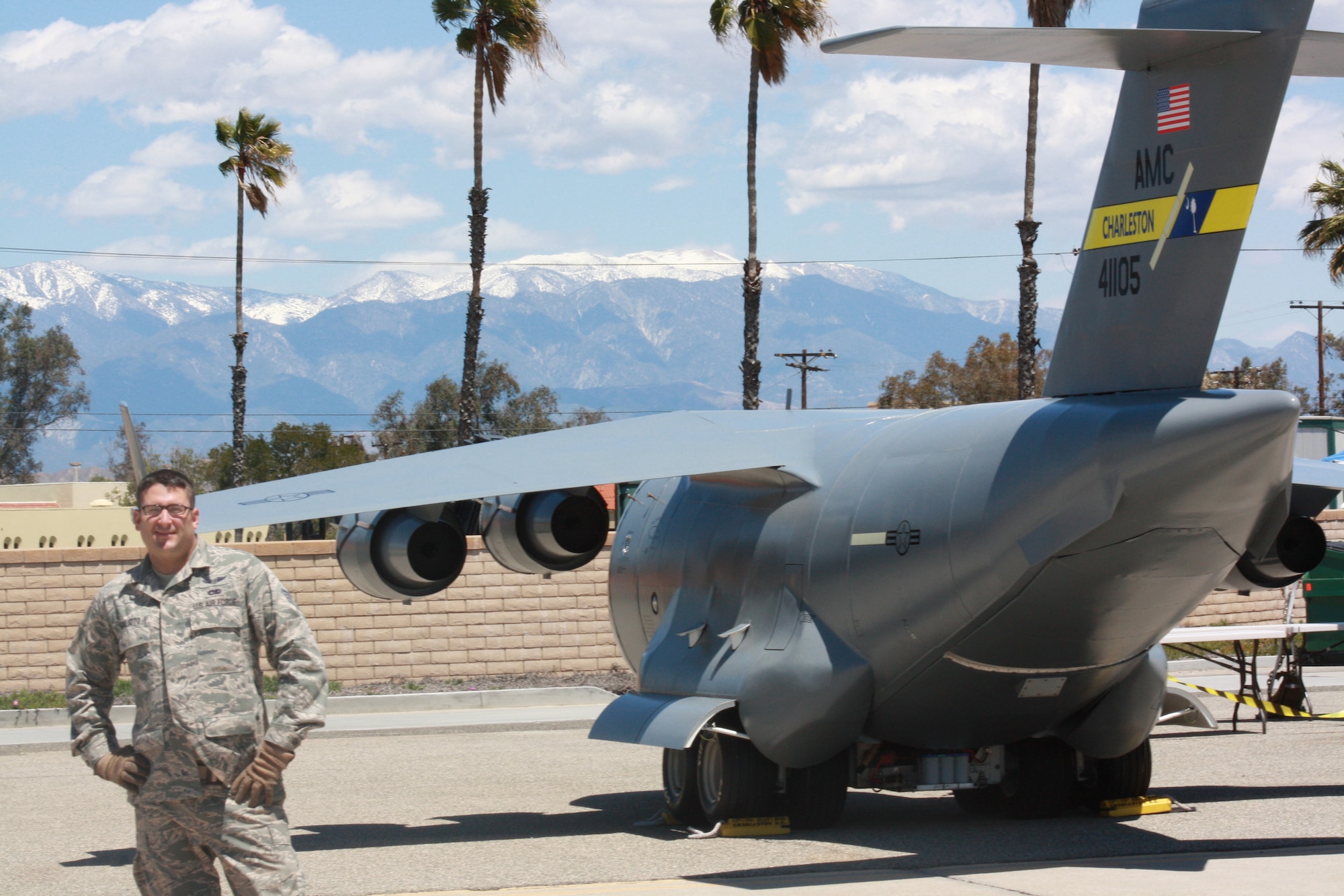 Tech Sergeant Tony Galiado stands near the Mini C-17 from Charlston Air Force Base S.C. The Mini C-17 was on display during AirFest 2010 at March Air Force Base Calif. The Mini C-17 is a recruiting and community outreach tool for the 315th Airlift Wing and the Air Force Reserve (U.S. Air Force Photo/ TSgt Beth Holzbaur)