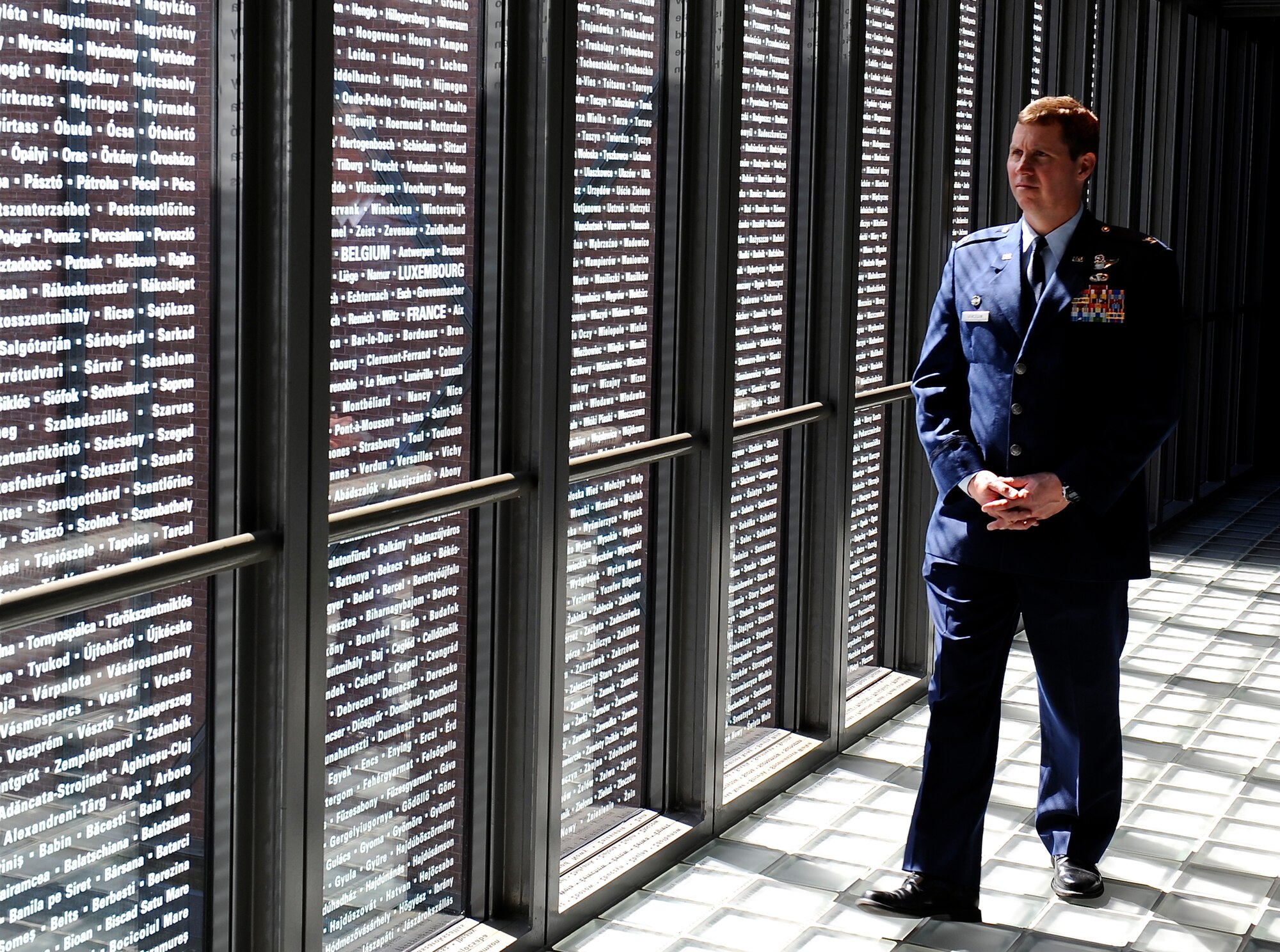 WASHINGTON -- Col. Thomas Bergeson, 3rd Wing commander tours the Holocaust museum May 5. Etched in the glass are the names of the towns and cities whose Jewish communities were totally or partially lost as a result of the "Final Solution". (Air Force photo by Staff Sgt. Brian Ferguson)
