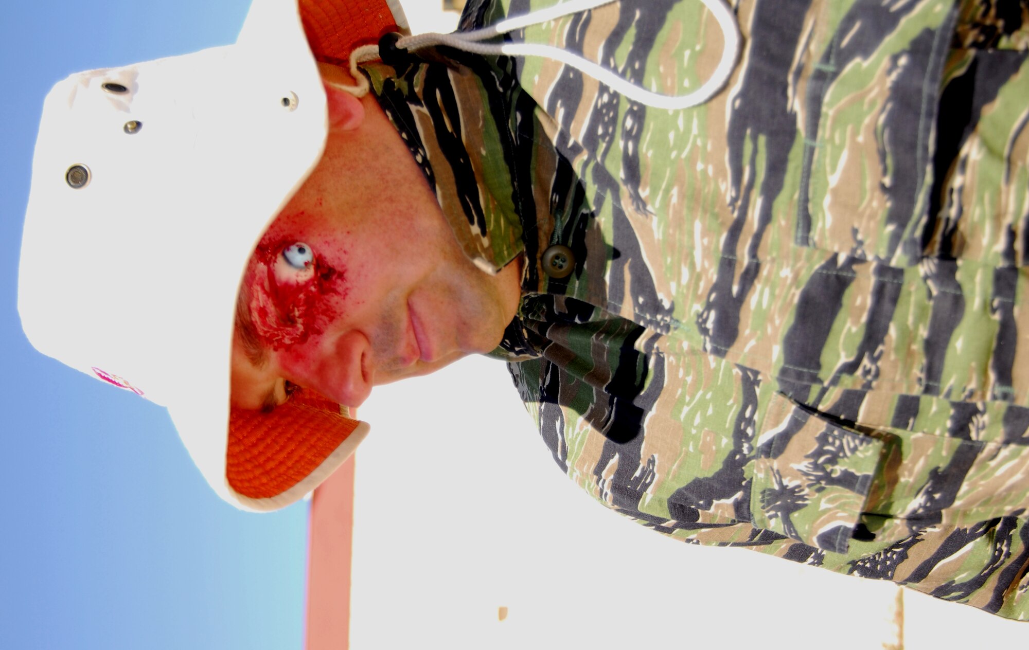Making all participants' simulated injuries look as real as possible is accomplished through use of moulage.  Make-up artists having been useing moulage for several decades to make simulated injuries look more real on camera.  The military uses moulage to train personnel, in a simulated environment, for real-world situations.  Here, moulage simulates an eyeball ejection. (Air Force photo by Stephen K. Robinson)