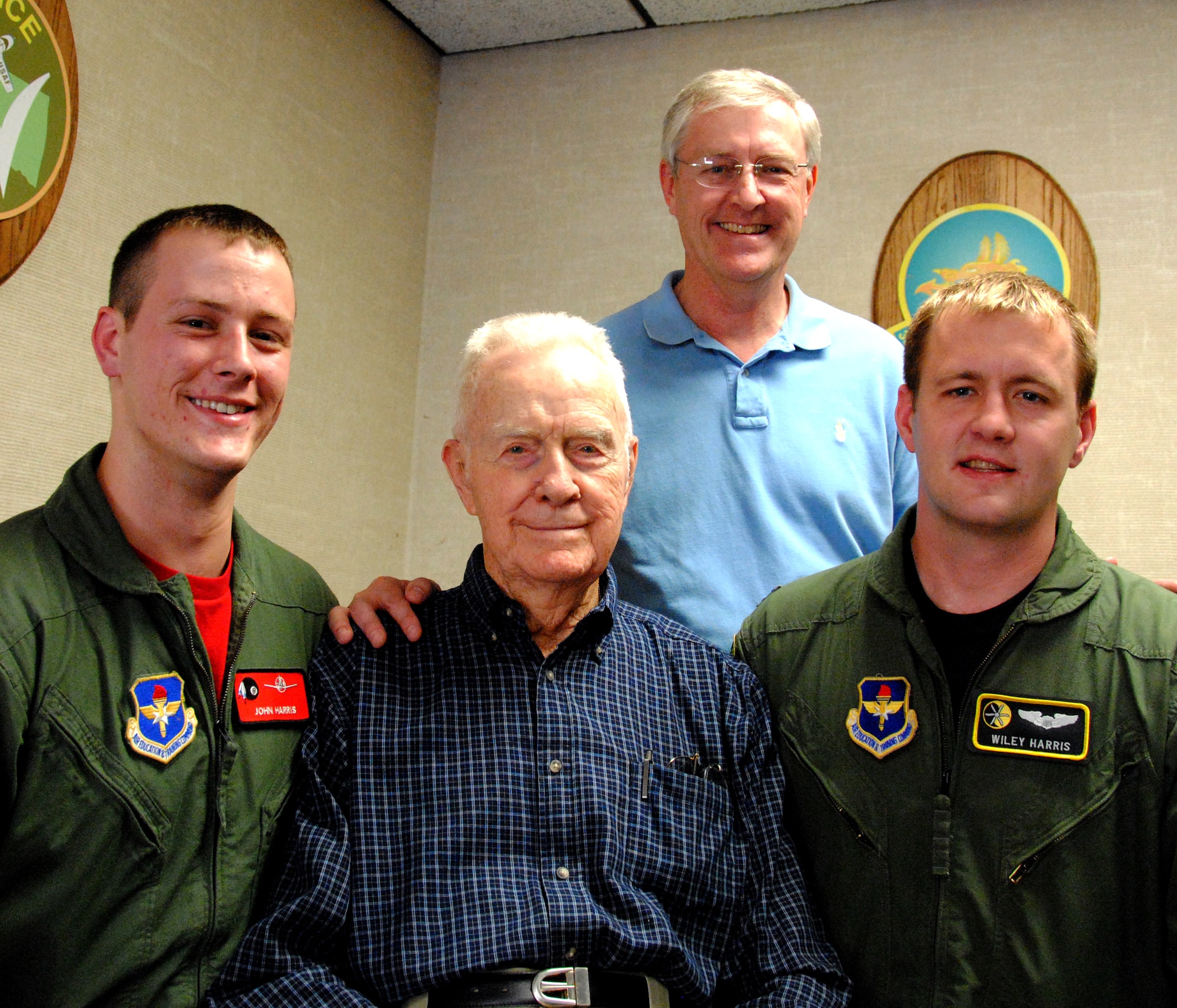 First row from left, 2nd Lt. John M. Harris; his grandfather, Air Force Col. John W. Harris retired; his brother, Capt. Wiley A. Harris; and in back row, his father, Air Force Col. Michael E. Harris retired; attend Lieutenant Harris’ track select ceremony April 23, at Vance AFB. (U.S. Air Force photo/ Joe B. Wiles)