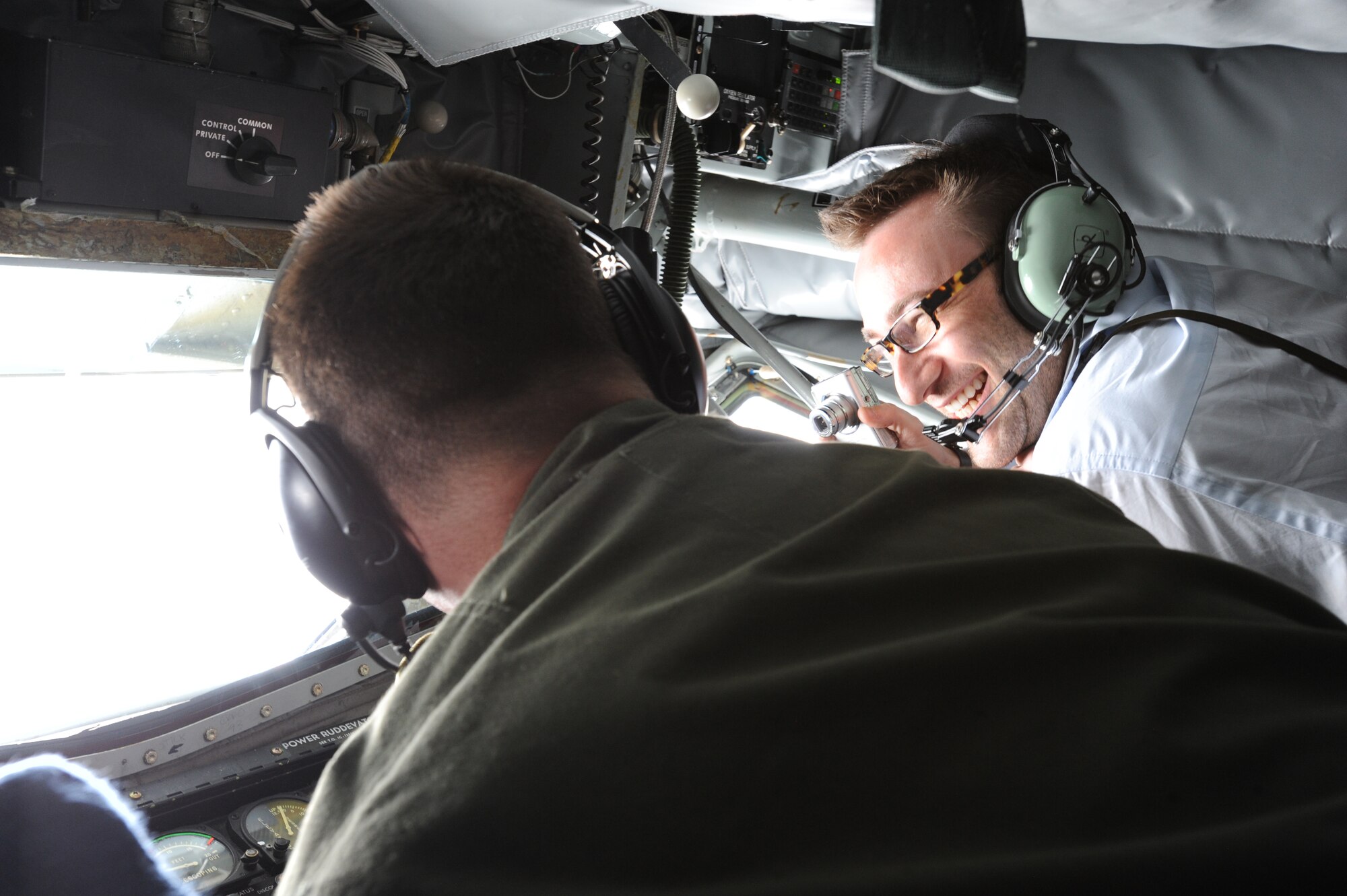 Tech. Sgt. Jeffrey Hollaway, 384th Air Refueling Squadron boom operator, demonstrates to Simon Sinek, motivational speaker, how to lower a KC-135 Stratotanker boom during a refueling flight April 29, 2010. Mr. Sinek took part in an operational refueling mission to view firsthand McConnell’s refueling mission. McConnell is host to the largest Stratotanker base in the world. (U.S. Air Force photo/Airman 1st Class Andrea Salazar)