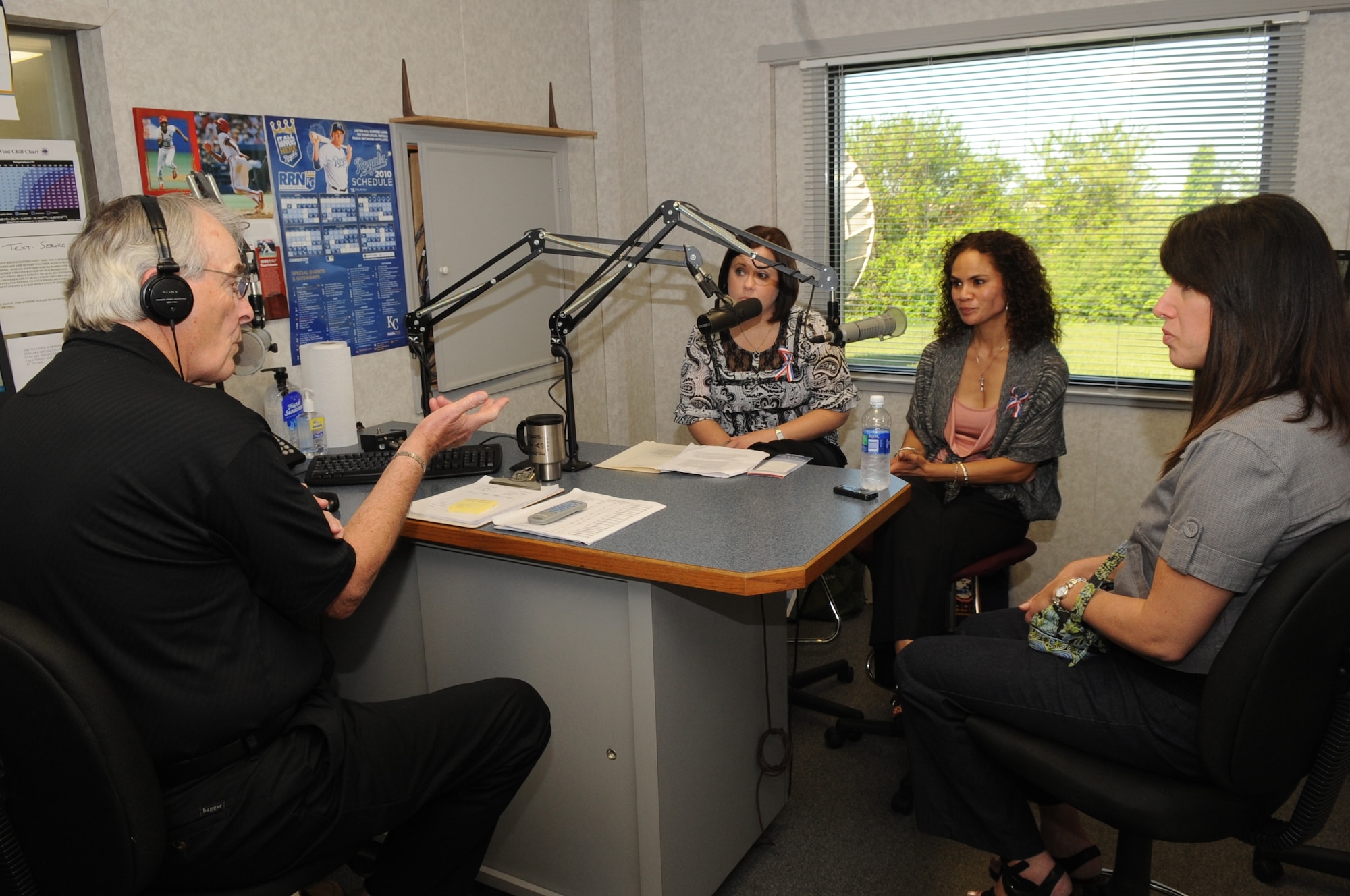 WARRENSBURG, Mo. - Cheryl Dodson and Ursula Martin, Air Force widows, speak to Marion Woods, KOKO radio, during a radio talk show as Rachel Wheeler, wife of Brig. Gen. Robert Wheeler, 509th Bomb Wing commander, looks on May 4, 2010. Their husbands, Col. George Martin, 36th Medical Group deputy commander, and Capt. Michael Dodson, Air Force pilot, perished in a B-52 crash off the coast of Guam July 21, 2008. (U.S. Air Force photo/Senior Airman Stephen Linch) 
