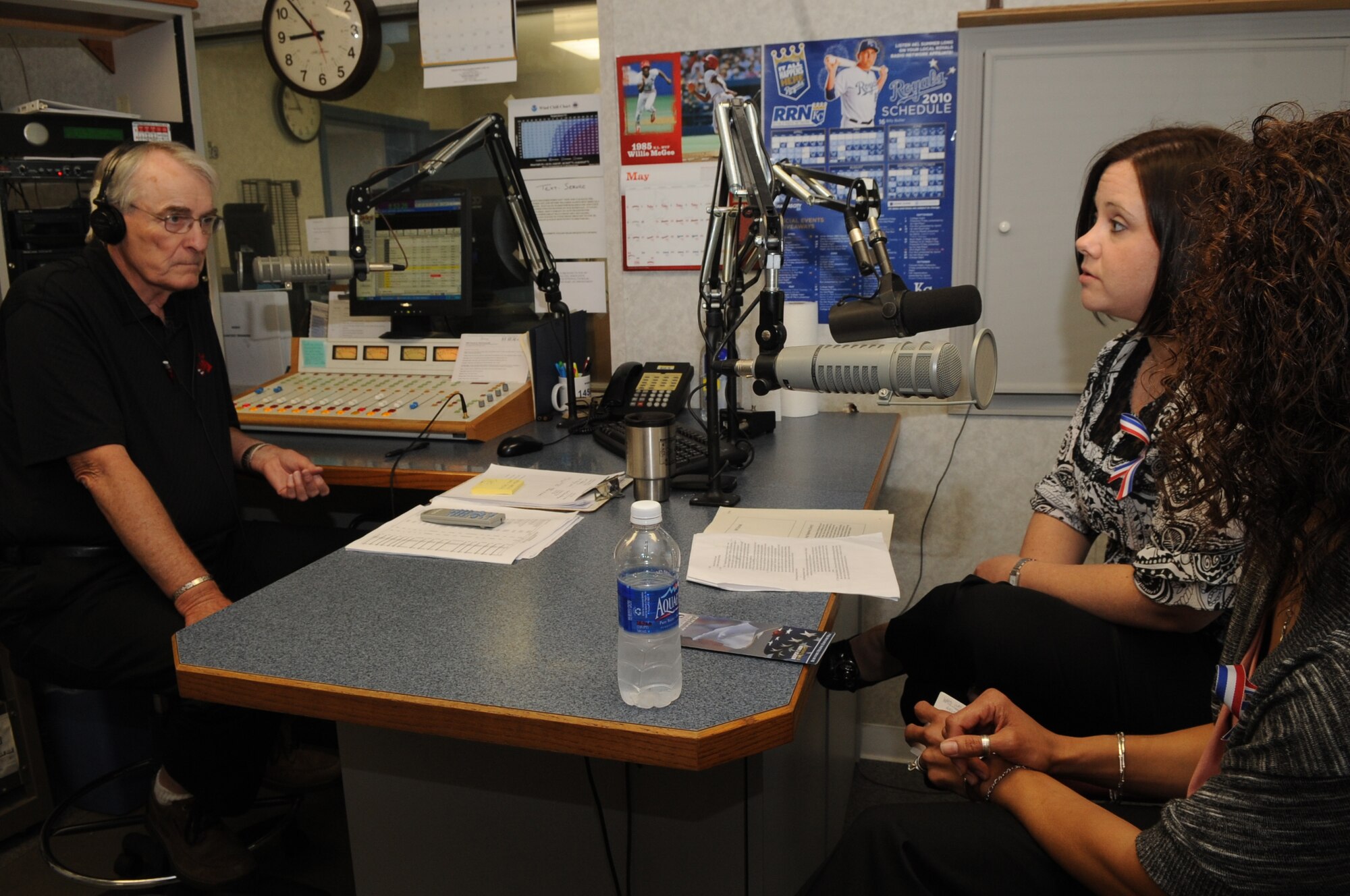 WARRENSBURG, Mo. - Cheryl Dodson and Ursula Martin, Air Force widows, speak to Marion Woods, KOKO radio, during a radio talk show May 4, 2010. Their husbands, Col. George Martin, 36th Medical Group deputy commander and Capt. Michael Dodson, Air Force pilot, perished in a B-52 crash off the coast of Guam July 21, 2008. (U.S. Air Force photo/Senior Airman Stephen Linch) 
