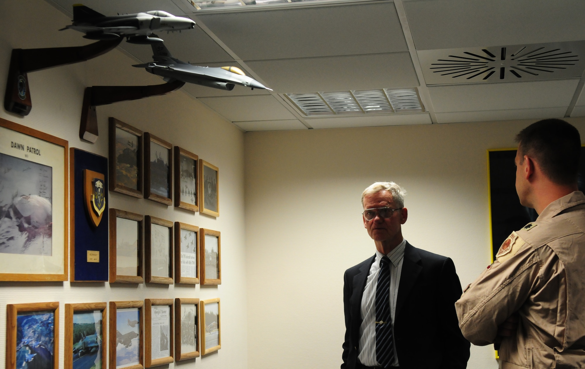 SPANGDAHLEM AIR BASE, Germany -- Lt. Col David Trucksa, right, 81st Fighter Squadron director of operations, discusses the history of the 81st FS with retired Maj. Gen. Peter Robinson, former 36th Tactical Fighter Wing commander, during a visit May 5.  General Robinson was first assigned as a fighter pilot to the 81st FS and later served as the commander of Bitburg Air Base prior to its closure.  (U.S. Air Force photo/Staff Sgt. Heather M. Norris) 