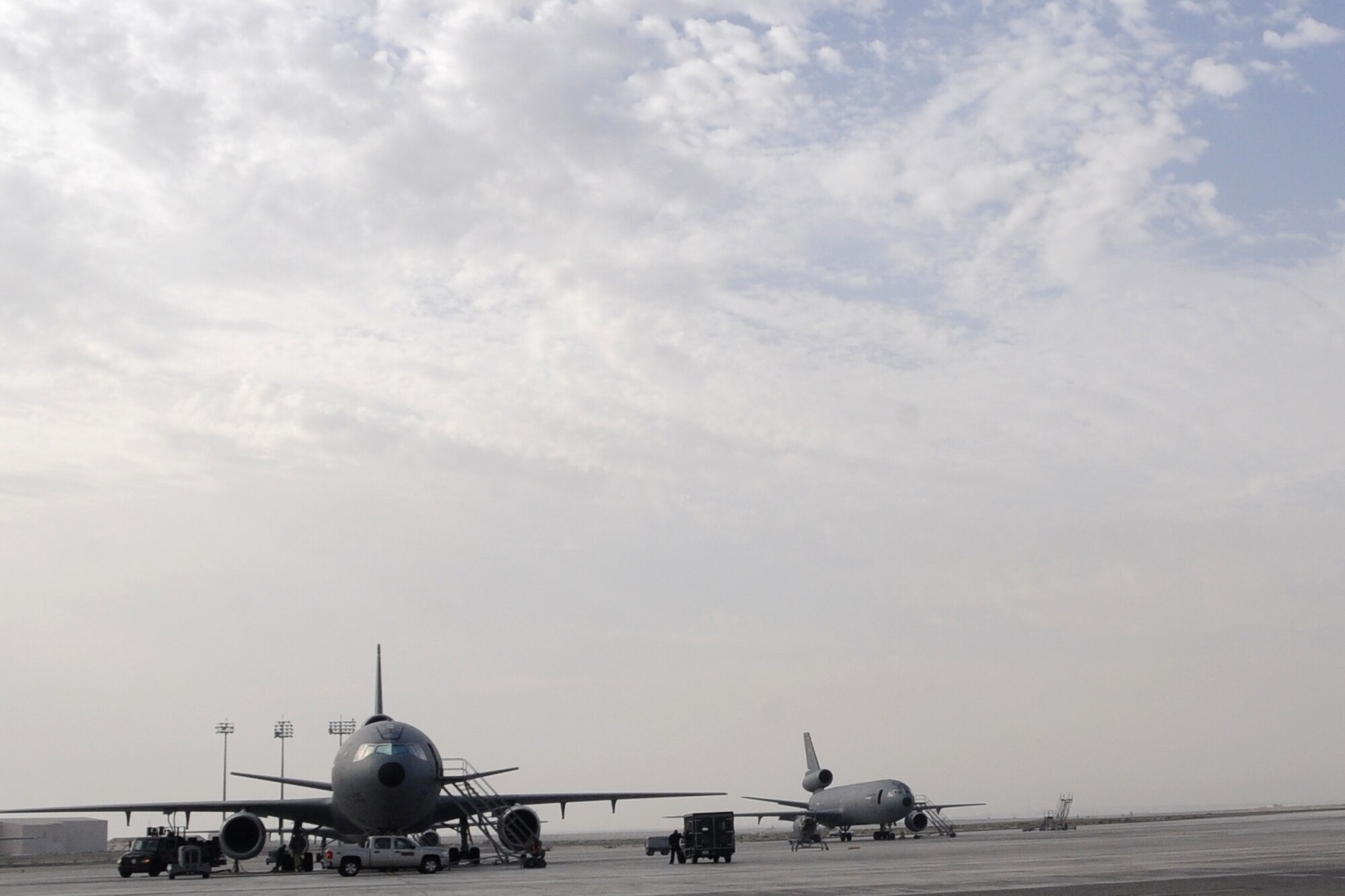 KC-10 Extenders sit at an undisclosed location in Southwest Asia on May 5, 2010. The KC-10 Extender is an advanced tanker and cargo aircraft designed to provide increased global mobility for U.S. Armed Forces. In 2009, KC-10s assigned to the 380th Air Expeditionary Wing flew more than 40,000 hours in support of 4,760 combat missions where they offloaded 422,000,000 pounds of fuel to 31,000 aircraft. They provided direct support to more than 2,750 "troops in contact" actions. (U.S. Air Force photo/Senior Airman Jenifer H. Calhoun/Released)
