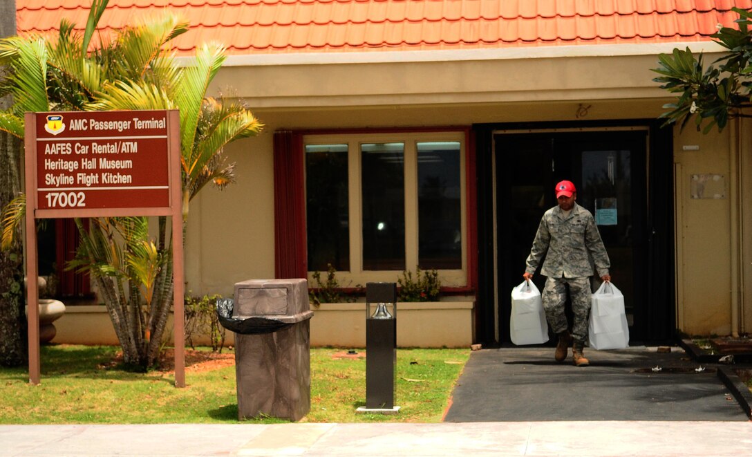 ANDERSEN AIR FORCE BASE, Guam?Staff Sergeant Jaimin Patel leaves the Andersen Flight Kitchen with an office lunch order, here on May 6, 2010. The Flight Kitchen is a new addition to the 36th Force Support Squadron. It opened June of last year and offers another meal option to team Andersen, especially those working on the flight line. (U.S. Air Force photo by Airman 1st Class Jeffrey Schultze)