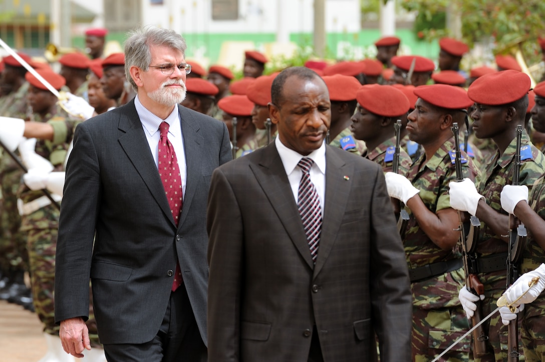 Burkina Faso Defense Minister Yero Boly and U.S. Ambassador J. Anthony Holmes, deputy to the commander of U.S. Africa Command for Civil-Military Activities, arrive May 3, 2010, to begin the opening ceremony for Flintlock 10 in Ouagadougou, Burkina Faso. 