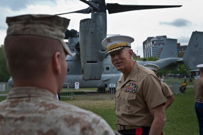 Gen. James T. Conway, commandant of the Marine Corps speaks to Marines about the success of Marine Week Boston May 6, 2010. Conway visited various sites of static displays to thank Marines for their efforts and Bostonians for their support. Marine Week gives Bostonians an all access pass to the Corps' culture.