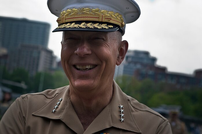 Gen. James T. Conway, commandant of the Marine Corps hears a joke from a Marine manning a static display at Boston Common May 6, 2010. Conway visited Marines who have been interacting with Bostonians during Marine Week May 3-9 to thank them for their hard work and Bostonians for their support of the men and women in uniform.