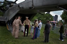 Gen. James T. Conway, commandant of the Marine Corps hears first hand the success of Marine Week Boston from a group of Marines May 6, 2010. Marines were staged in Boston Common all week with static displays to interact with the Boston public. Marine Week gives the Boston public an opportunity to engage Marines that perform a wide array of jobs in support of the nation's defense.