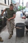 Cpl. Timothy Brukner, a rifleman of 3rd Battalion, 24th Marines, Johnson City, Tenn., spreads fresh mulch in front of the Brook House in Boston in support of Marine Week Boston, May 6, 2010. The Brook House is used as local adult pre-release facility.