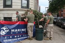 Marines of 3rd Battalion, 24th Marines, Johnson City, Tenn., spread fresh mulch and plant new flowers in front of the Brook House in Boston in support of Marine Week Boston, May 6, 2010. The Brook House is used as local adult pre-release facility.