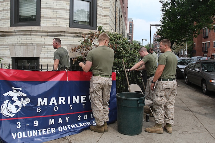 Marines of 3rd Battalion, 24th Marines, Johnson City, Tenn., spread fresh mulch and plant new flowers in front of the Brook House in Boston in support of Marine Week Boston, May 6, 2010. The Brook House is used as local adult pre-release facility.