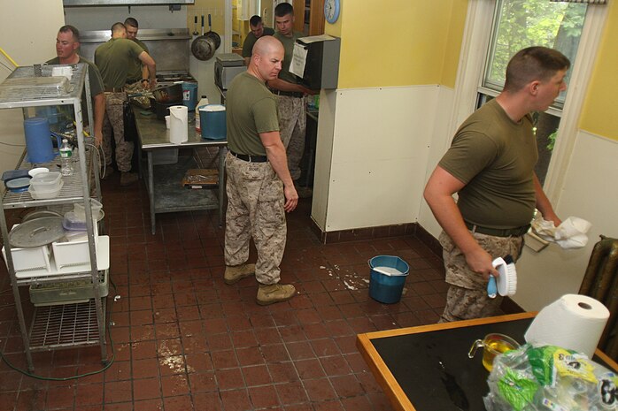 Marines of 3rd Battalion, 24th Marines, Johnson City, Tenn., clean the kitchen in an effort to help renovate the Robert J. Watson House, in Cambridge, Mass., in support of Marine Week Boston, May 6, 2010. Once Renovated, the Robert J. Watson House will be used as a shelter for troubled youth females.