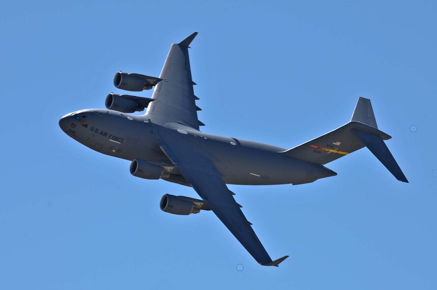 A C-17 soars above the crowd at the March Field AirFest, March Air Reserve Base, Calif., May 1, 2010. The AirFest is a bi-annual, two-day event featuring military and civilian aerial performances and static displays of modern and historic aircraft. (U.S. Air Force photo by Senior Airman Juan Duenas/Released)