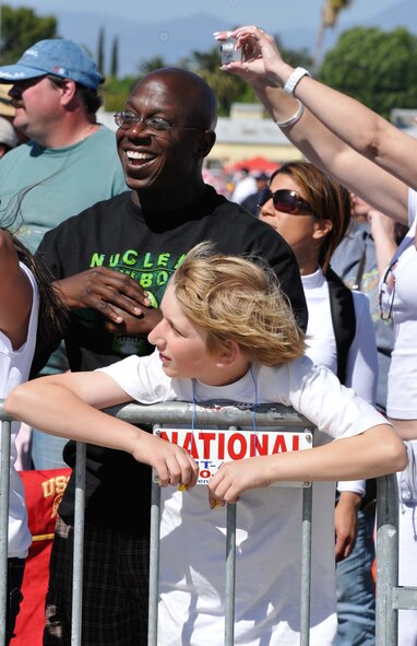 Crowd members enjoy the show at the March Field AirFest, March Air Reserve Base, Calif., May 1, 2010. The AirFest is a bi-annual, two-day event featuring military and civilian aerial performances and static displays of modern and historic aircraft. (U.S. Air Force photo by Senior Airman Juan Duenas/Released)