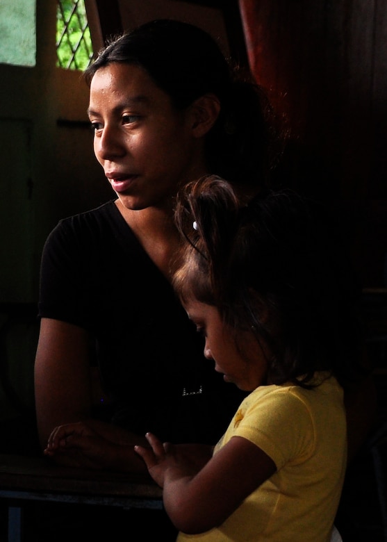 A mother and her child wait to be seen by the medical civic action program team made up of Soldiers, Airmen, and civilians from Joint Task Force-Bravo as well as Nicaraguan Soldiers and Ministry of Health personnel May 4 in El Ayote, Nicaragua. More than 25 American, Nicaraguan and Honduran medical professionals provided healthcare May 3-6 to more than 1,100 residents in and around El Ayote. (U.S. Air Force photo by Staff Sgt. Bryan Franks)