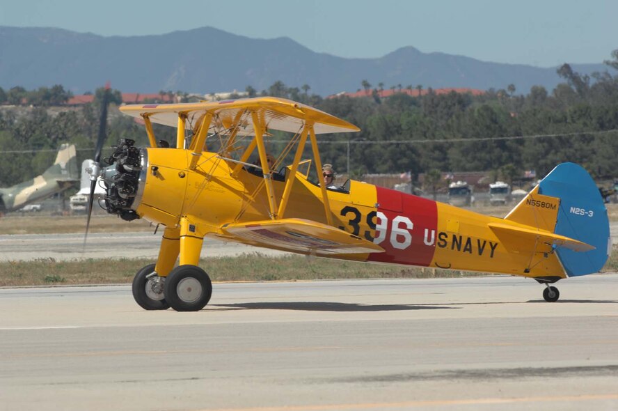A vintage Naval aircraft prepares for takeoff at the March Field AirFest, March Air Reserve Base, Calif., May 1, 2010. The AirFest is a bi-annual, two-day event featuring military and civilian aerial performances and static displays of modern and historic aircraft. (U.S. Air Force photo by Staff Sgt. Heather Cozad/released)