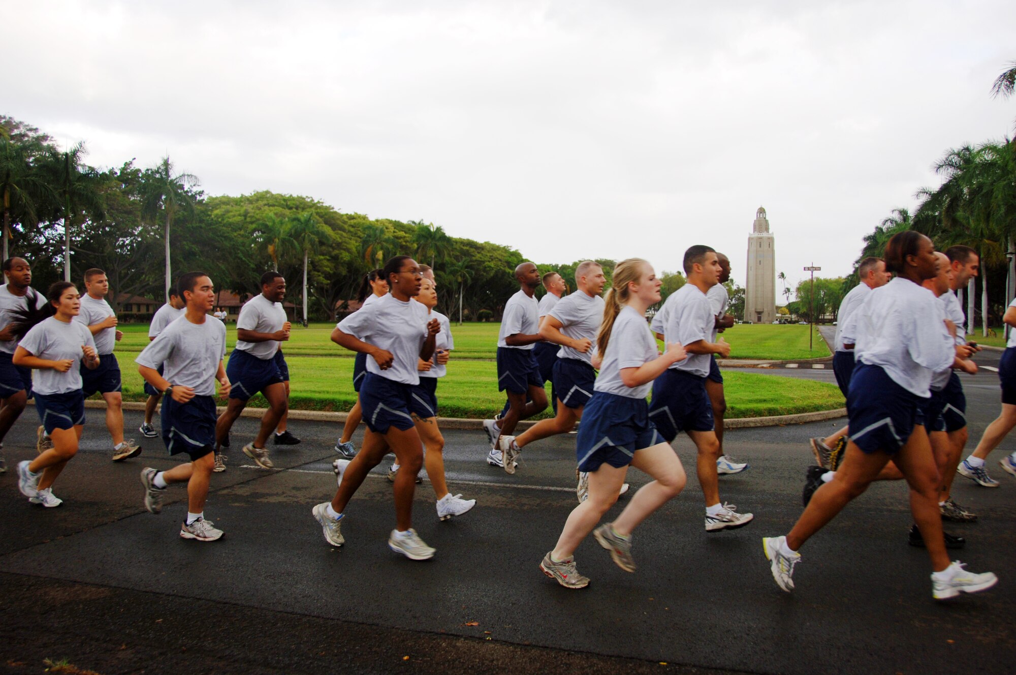 Airmen run past Freedom  Mall at the "Warrior Run" May 7 at Joint Base Pearl Harbor Hickam, Hi. Participants were addressed by Col. Giovanni Tuck, 15th Airlift Wing Commander before beginning the run - Col. Tuck's last as 15th AW commander. (U.S. Air Force photo by Senior Airman Nathan Allen)