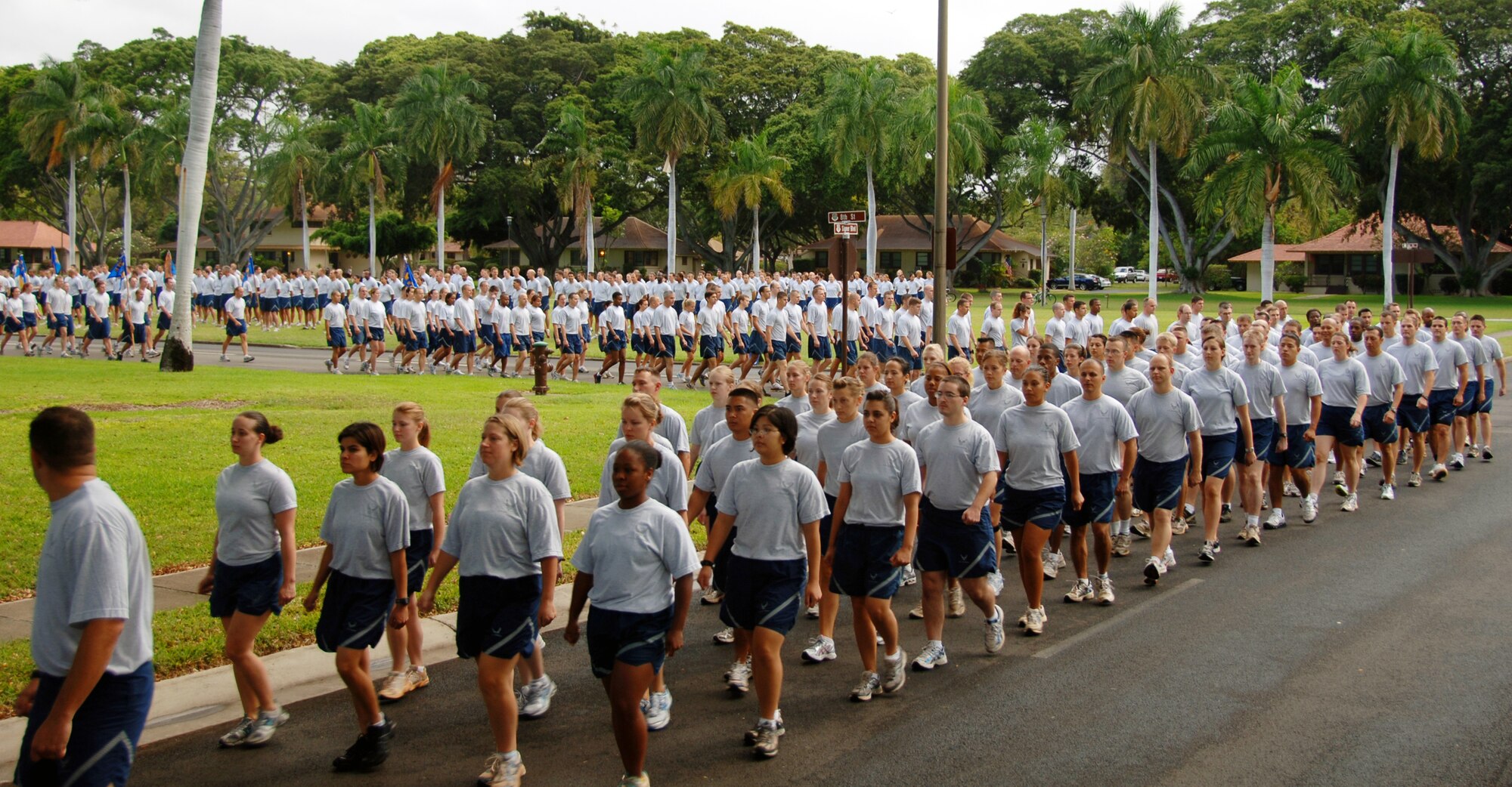 Airmen march in formation before marching "double time" at the "Warrior Run" May 7 at Joint Base Pearl Harbor Hickam, Hi. Participants were addressed by Col. Giovanni Tuck, 15th Airlift Wing Commander before beginning the run - Col. Tuck's last as 15th AW commander. (U.S. Air Force photo by Senior Airman Nathan Allen)