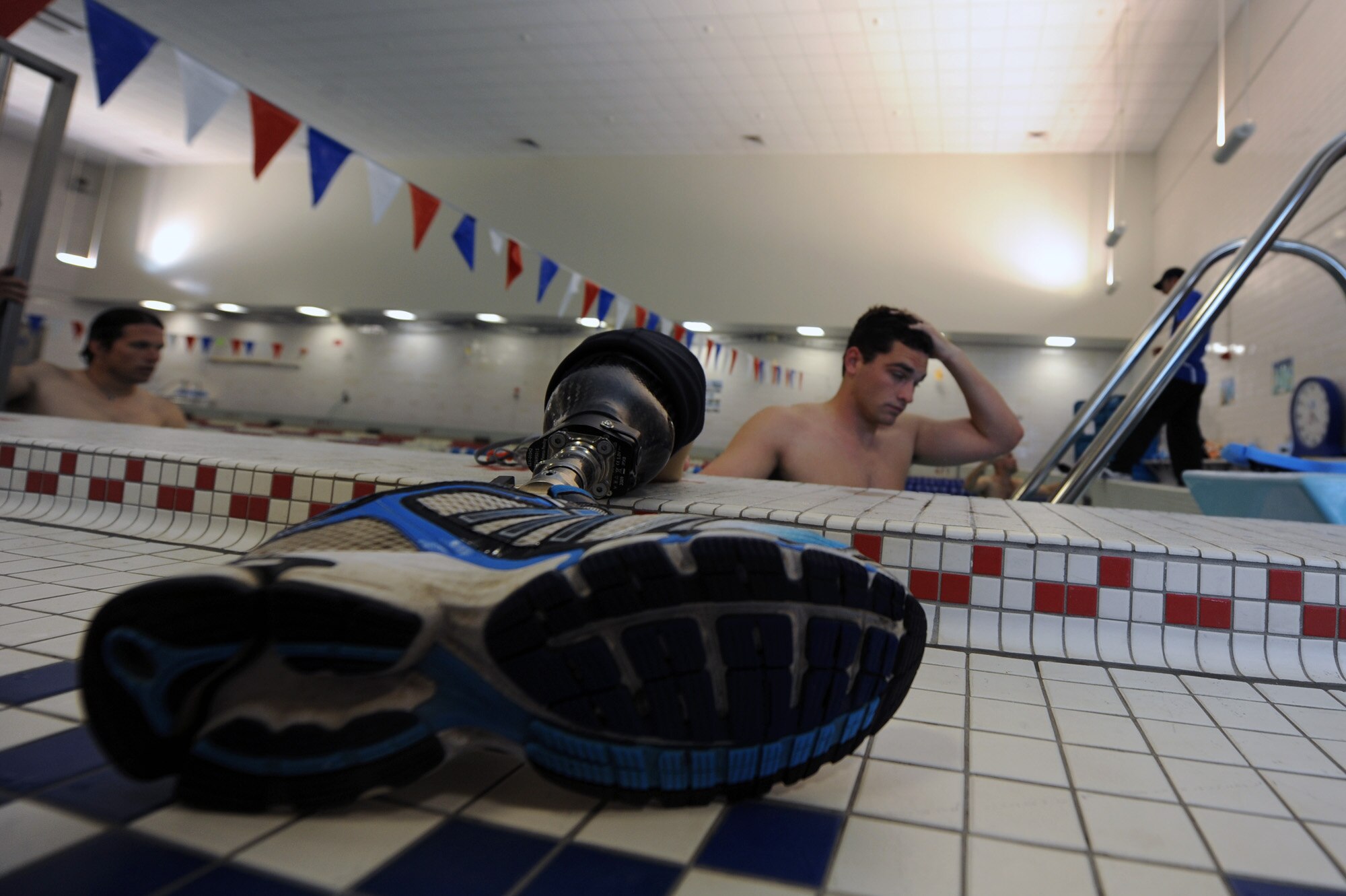 2nd Lt. Ryan McGuire takes a break after finishing a lap May 7, 2010, in the pool at the Air Force Academy in Colorado Springs, Colo.  Lieutenant McGuire, a member of the Air Force team that is participating in the inaugural Warrior Games, is from Laughlin Air Force Base, Texas. The Warrior Games competition begins May 10 and finishes on May 14 and is taking place at the U.S. Olympic Training Center in Colorado Springs.  (U.S. Air Force photo/Staff Sgt. Desiree N. Palacios)