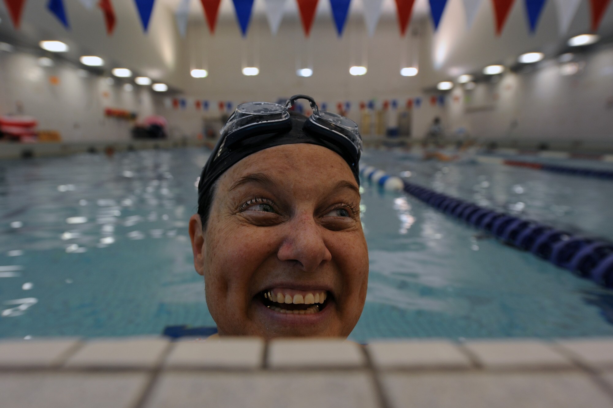 Jeanne Goldy-Sanitate smiles after finishing a lap in the swimming pool May 7, 2010, during her last day of training for the upcoming inaugural Warrior Games.  She and the other members of the Air Force team have been attending a training camp at the Air Force Academy in Colorado Springs, Colo. The Warrior Games competition began May 10 and finishes May 14 at the U.S. Olympic Training Center in Colorado Springs.  (U.S. Air Force photo/Staff Sgt. Desiree N. Palacios)