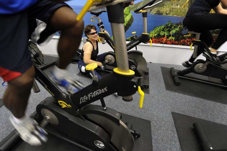 Jeanne Goldy-Sanitate (center) prepares for the inaugural Warrior Games May 7, 2010, by working out in a spin class during her last day of training camp at the Air Force Academy in Colorado Springs, Colo.  Ms. Goldy-Sanitate is competing along with 17 other Air Force Athletes during the Warrior Games competition through May 14 at the U.S. Olympic Training Center in Colorado Springs.  (U.S. Air Force photo/Staff Sgt. Desiree N. Palacios)