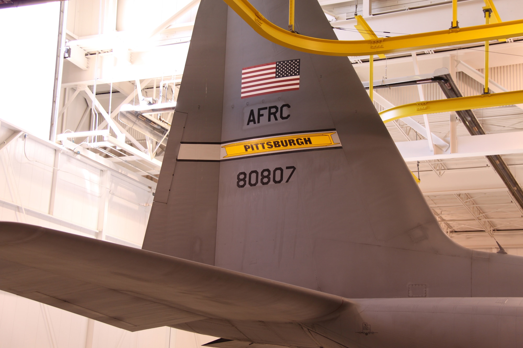 Aircraft 807 is the first C-130 to receive new tail flashing.  The steel beam represents the strong bond the 911th Airlift Wing has with the community of Pittsburgh and recognizes the city’s rich heritage.