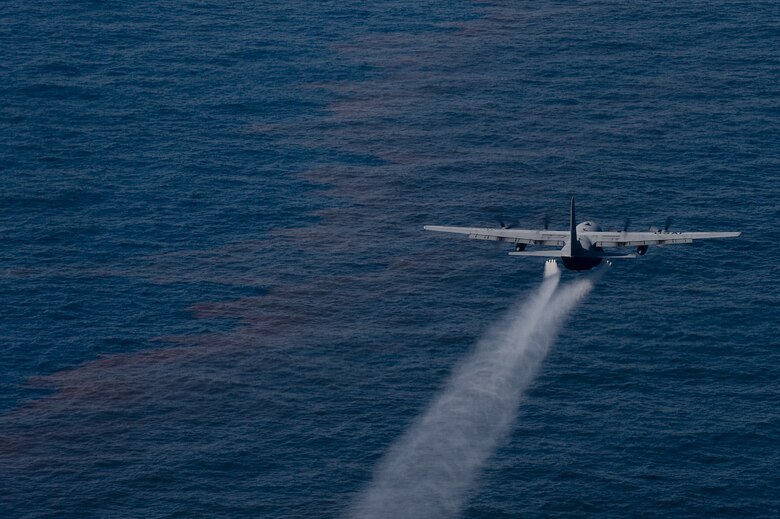 A C-130 aircraft from the 910th Airlift Wing, Youngstown Air Reserve Station, Ohio, drops an oil-dispersing chemical into the Gulf of Mexico as part of the Deepwater Horizon Response effort May 5, 2010. Reservists from the 910th AW are in Mississippi to assist in cleanup efforts. The wing specializes in aerial spray and is the Department of Defense's only large area fixed-wing aerial spray unit. (U.S. Air Force photo/Tech. Sgt. Adrian Cadiz)